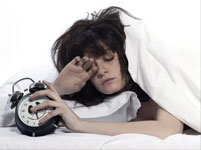 woman in bed waking up