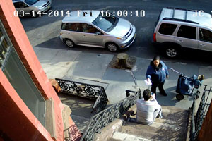 Al on his stoop with the Postal Worker